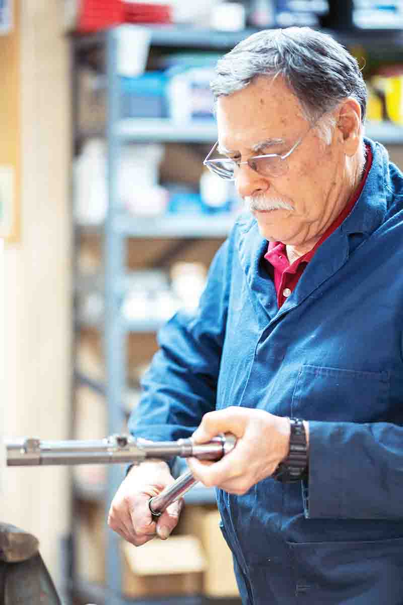 Revenant Rifles engineer, Larry Nelson, assembles an action for the Ovis rifle.